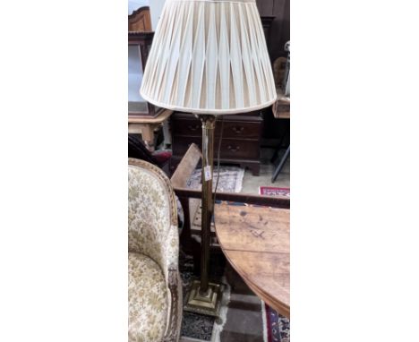 A brass Corinthian column standard lamp, height excluding shade 126cm