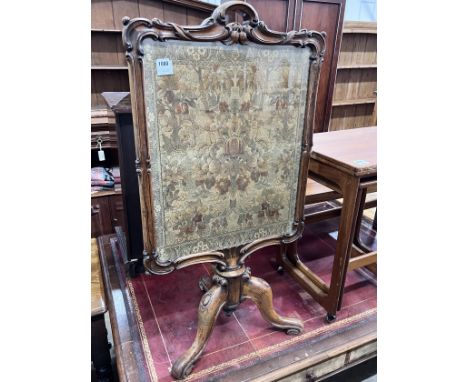 A Victorian carved rosewood firescreen with tapestry banner, width 58cm, height 106cm