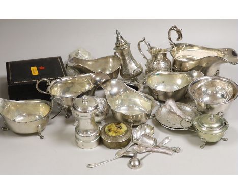 A mixed collection of small silver and plated items to include five various sauceboats, a cased pair of pepper pots, a chased