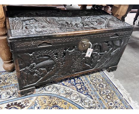 A Chinese carved camphorwood trunk, length 96cm, depth 48cm, height 50cm