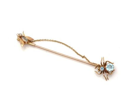 An early 20th Century 9ct yellow gold tie pin, of spider and fly design, set with blue topaz and seed pearls, 6.2cms long, 1.