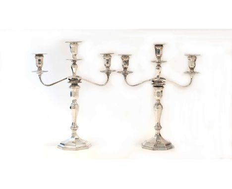 A pair of Victorian silver two-branch three-light candelabra, by Hawksworth, Eyre &amp; Co Ltd, Sheffield 1899, each octagona