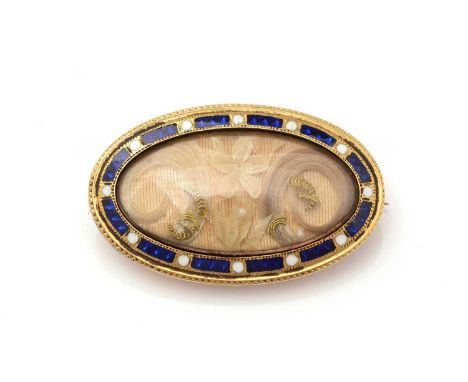 A Victorian hair-work and enamel mourning brooch, the oval central plaque with cut hair in floral design, within a white and 