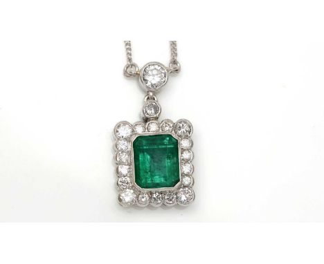 An emerald and diamond cluster pendant, the square step-cut emerald measuring 6.4 x 6.1 x 4.6mm, surrounded by eighteen brill