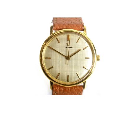 Omega: a gilt-cased wristwatch, the silvered baton dial with central seconds hand, fitted a manual wind 17-jewel movement, se