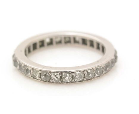 A diamond eternity ring, set with twenty-seven old cut diamonds, in platinum mount, ring size K, 4.0g gross.