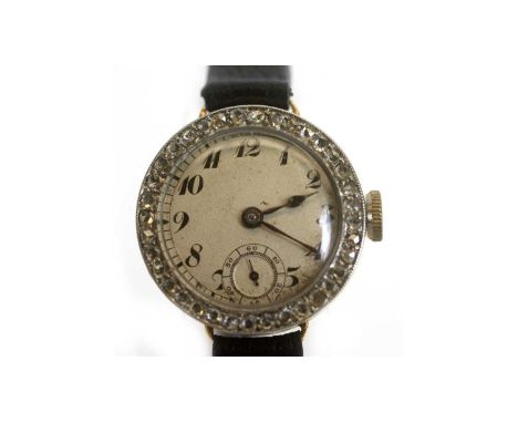 An early 20th Century lady's cocktail watch, the silvered arabic dial with subsidiary seconds dial within a diamond bezel, fi