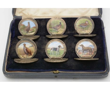An Edward VII set of six enamelled silver menu stands/place markers, by Sampson Mordan &amp; Co Ltd, Chester 1904, decorated 