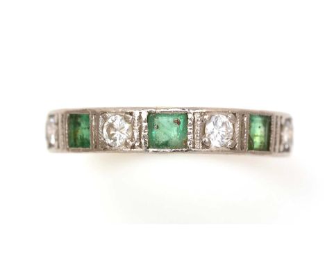 An emerald and diamond half-hoop eternity ring, set with three square step-cut emeralds parted by four brilliant cut diamonds