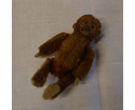 Miniature Schuco compact in the form of a monkey