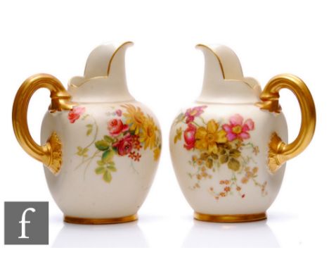 A pair of Royal Worcester blush ivory shape 1094 flat back jugs, both decorated with floral sprays, green and puce mark with 