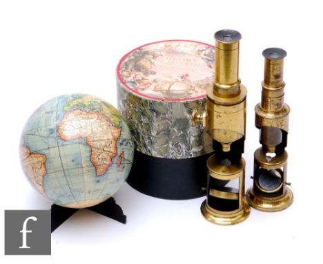 Two late 19th to early 20th Century brass adjustable student's microscopes and a replica&nbsp; French Globe Universal in prin