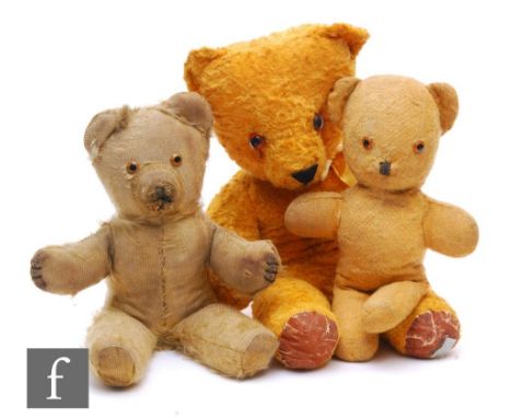 Three mid century English unjointed teddy bears, to include a Chad Valley bear with golden artificial silk plush and rexine p