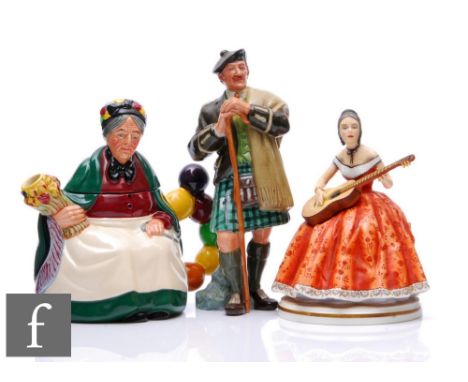 A Royal Doulton novelty teapot modelled as the Old Balloon Seller marked to the base 'The Property of Royal Doulton Tableware