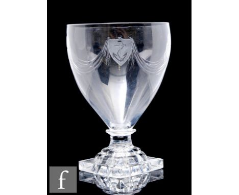 A large late 18th Century clear crystal rummer, circa 1800, the ovoid bowl with polished swags and alternating anchor and sta