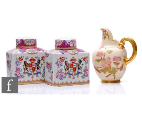 A pair of late 19th to early 20th Century Samson armorial tea caddies each decorated with a heraldic crest within floral spra