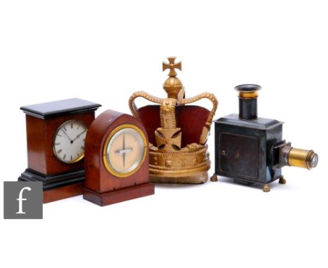 An Edwardian mahogany cased G.P.O clock, height 18cm, a small mantle clock, a magic lantern and a painted gilt crown finial, 