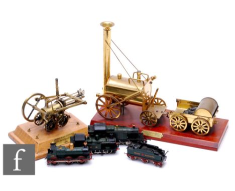 A 20th Century brass scale model of Stephenson's rocket, height 27cm, a similar model steam engine, both mounted on wooden pl