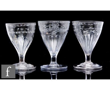 A near pair of 19th Century clear crystal rummers, circa 1810, the conical bowl decorated with engraved star and dot banding 