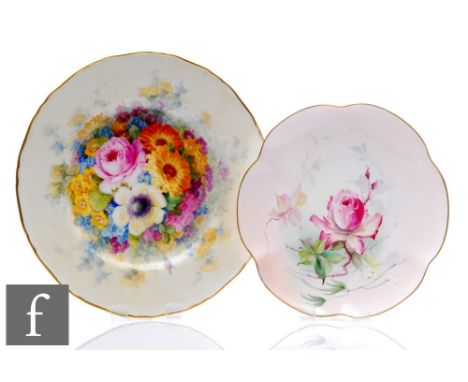 Two Royal Worcester cabinet plates, the first decorated by W. Austin with a hand painted rose against a pale pink ground, sig