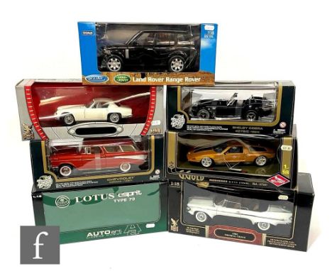 A collection of seven 1:18 scale diecast model cars by Guiloy, AutoArt and similar, to include a Shelby Cobra, Land Rover Ran