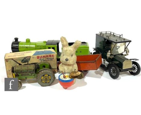 A collection of assorted toys, to include a handmade wooden 2-4-0 LNER green push along locomotive, a Mettoy tinplate tractor