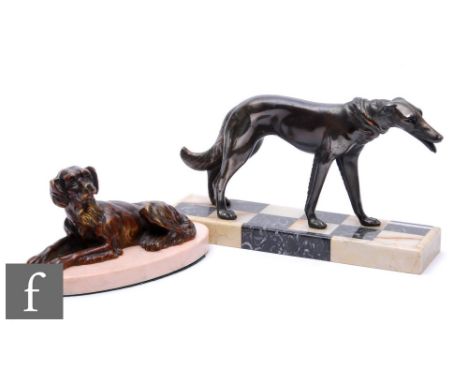 A 20th Century bronze study, modelled as a recumbent spaniel, mounted to an oval marble base, height 12cm, width 23cm, and a 