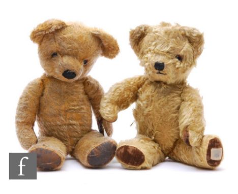 Two 1950s Chad Valley teddy bears, the first with golden mohair and velveteen paw pads, label to foot, the other in golden mo