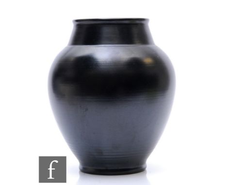 A Pilkingtons Royal Lancastrian vase by John Brannam glazed in black, impressed and incised marks, height 24cm. 