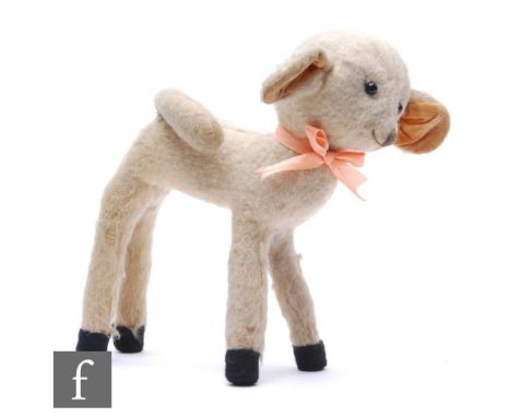 A Chad Valley lamb, circa 1930s, white mohair, red Hygienic Toys label, height 25cm, well loved. 