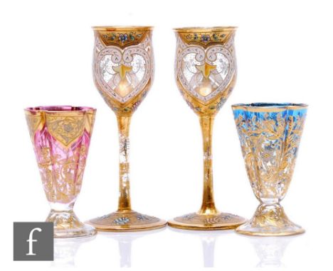 A matched pair of late 19th Century Moser shot glasses of tapered quatrelobed form with splayed foot, enamel and relief paste