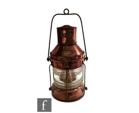 A 20th Century copper and brass ships lantern named Anchor Meterorite No 113031, ribbed glass lens, height 52cm. 