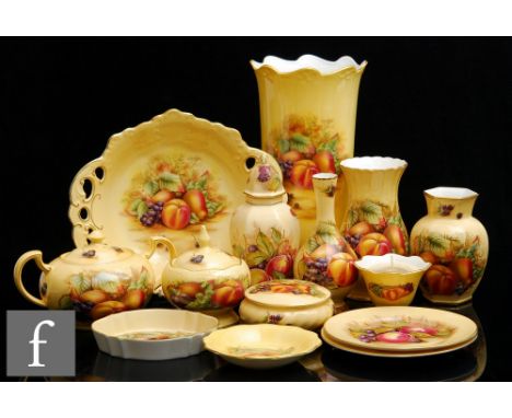 A collection of assorted later 20th Century Aynsley Orchard Gold to include vases of varying form, powder bowls, a sugar bowl