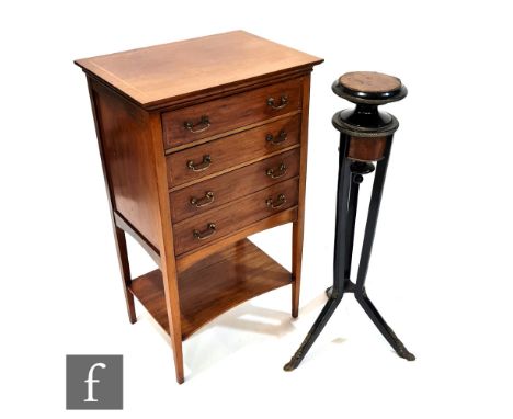 An Edwardian mahogany music cabinet, the top with satinwood inlaid border above four fall-front drawers and an under-shelf, h