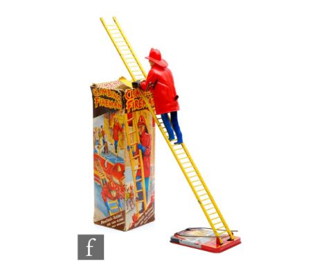 A 1960s Marx Climbing Fireman, tinplate and plastic toy, clockwork with integral key, with box. 