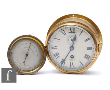 A Smith's Astral brass bulkhead clock, width 18cm, and a brass circular aneroid barometer. (2) 