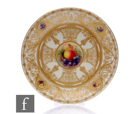 A Royal Worcester hand painted cabinet plate decorated by R Seabright with hand painted fruits and foliage within a gilt over