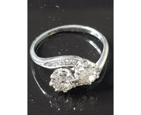 PLATINUM AND DIAMOND 2 STONE RING RIGHT HAND STONE 0.75CTS LEFT HAND STONE 0.72CTS DIAMONDS ASSESSED AS COLOUR J/K CLARITY SI