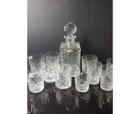 CRYSTAL GLASS WHISKY DECANTER AND HALLMARKED 1977 BIRMINGHAM SILVER LABEL PLUS 10 CRYSTAL GLASS TUMBLERS