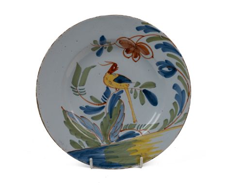 An 18th century English Delftware plate Probably by Richard Frank of Redcliffe Back, Bristol, is centrally decorated with an 