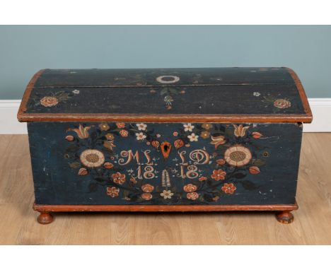 A 19th century Swedish marriage chest The dome-top painted chest decorated with flowers and with initials 'M.L. L.D.' and dat
