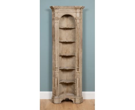 A set of Georgian-style corner alcove shelves Of architectural form with fluted pilaster columns to either side of the shaped
