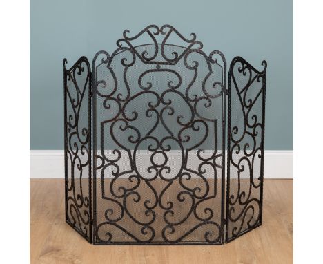 A three-section fireguard The fireguard with scrolling ornament.120cm wide x 103cm high overallQty: 1Signs of use. In good co