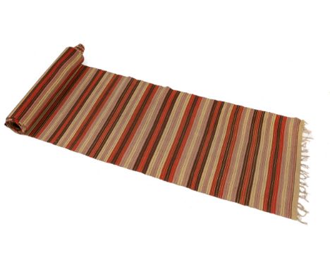 A 20th century hand-woven Kilim runner The long runner with red, brown, pink, and mustard stripes.Approximately 977cm long x 