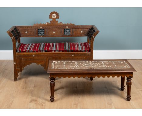 A Syrian hardwood bench and a similar occasional table The bench with carved geometric decoration, turned panels, and mother-