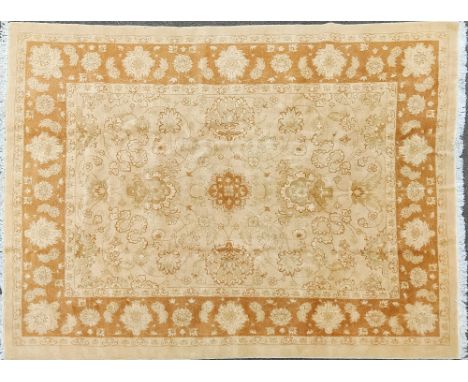 A late 20th century English Ziegler Mahal-style carpet With a cream ground and all-over arabesque decoration within a guarded