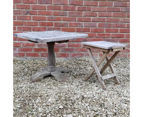 Two garden occasional tables The first an oak table with a square top and quatreform base; the second with a square top and a