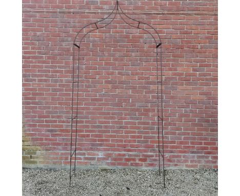 A wrought iron rose arch The arch of simple form and with ogee shaped top126cm wide x 48cm deep x 266cm high overall