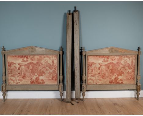 A 19th century bed The painted architectural ends with outset fluted pilaster columns beneath turned finials, the ends uphols