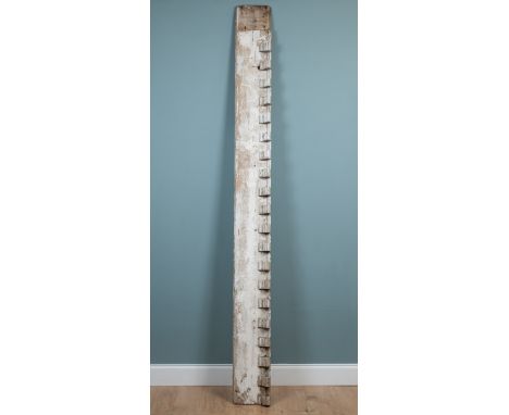 A white-painted pine architectural shop fitting board With a repeating bracket decoration to the top.300cm wide x 28cm highQt